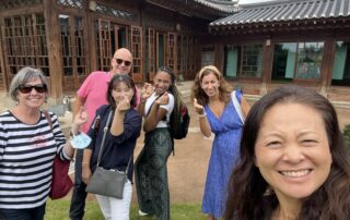 near hanok in korea with a group of people