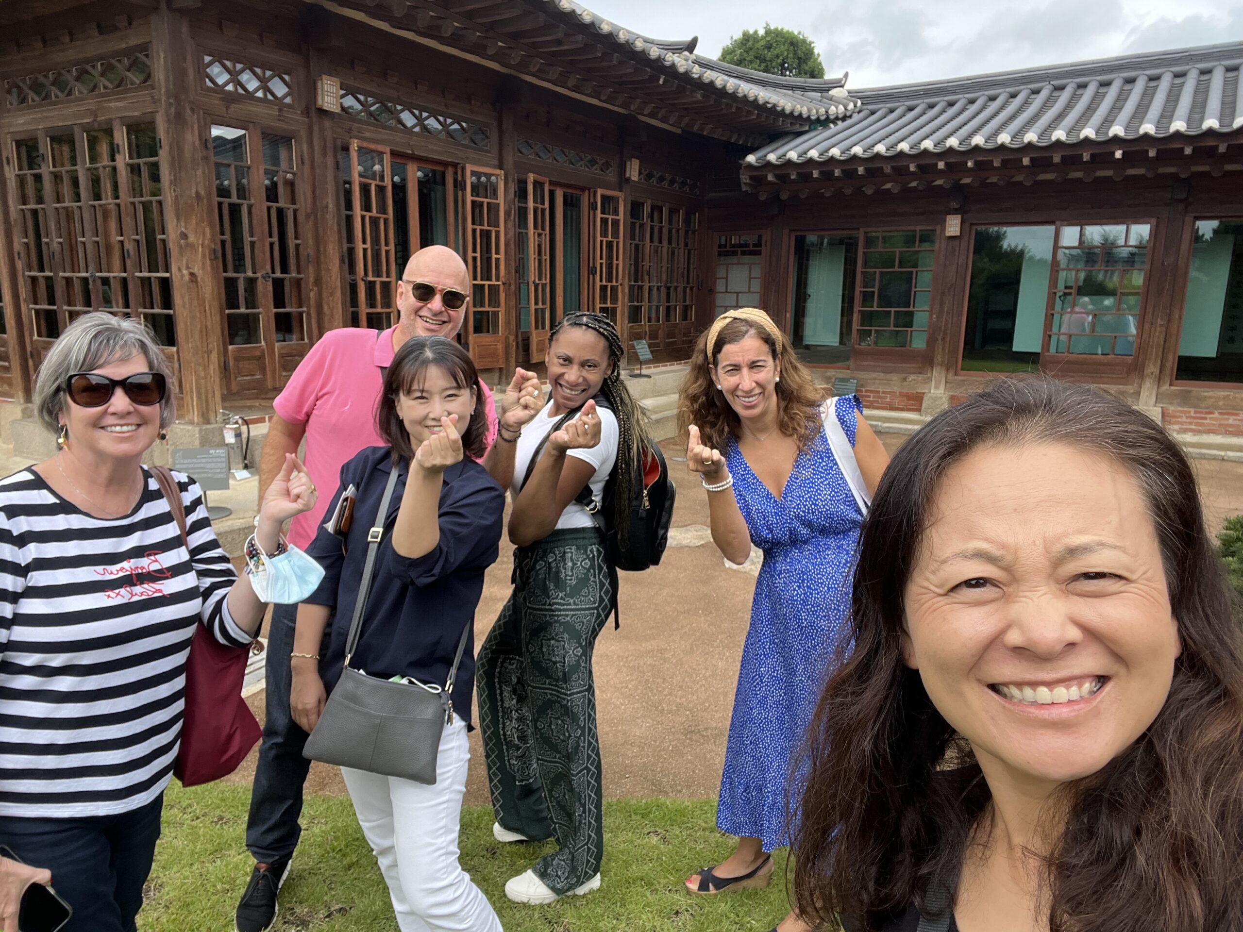 near hanok in korea with a group of people